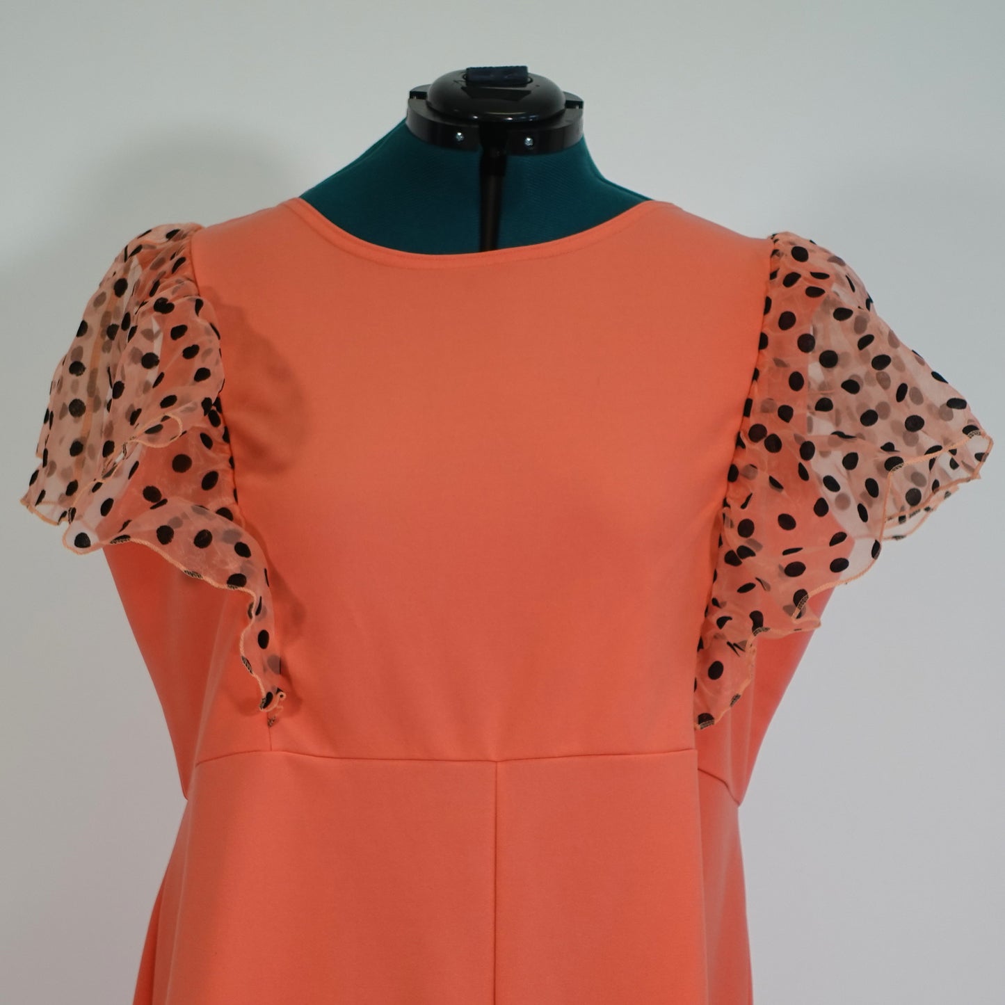 Coral Romper with Black Polka Dot Ruffle Sleeves