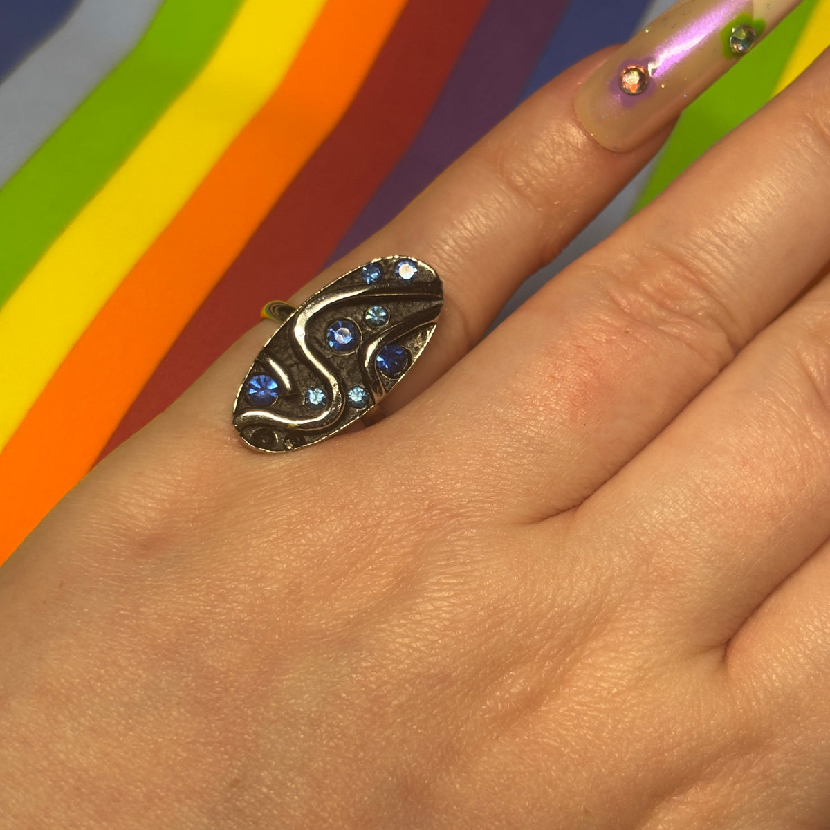 Silver Toned Oval Cocktail Ring with Blue Stones